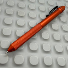 Load image into Gallery viewer, > Spoke Click Model CX: Orange Aluminum / Knurled Cylindrical Grip (black clip)