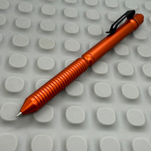 Load image into Gallery viewer, > Spoke Click Model CX: Orange Aluminum / Grooved Cylindrical Grip