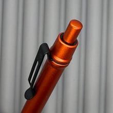 Load image into Gallery viewer, > Spoke Click Model CX: Orange Aluminum / Black Grooved Cylindrical Grip