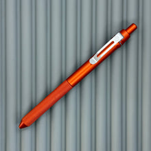 Load image into Gallery viewer, > Spoke Click Model CX: Lava Orange Aluminum / Knurled Cylindrical Grip (silver clip)