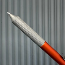 Load image into Gallery viewer, > Spoke Click Model C: Aluminum, Lava Orange / Matte Titanium Knurled Grip