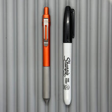 Load image into Gallery viewer, > Spoke Click Model C: Aluminum, Lava Orange / Matte Titanium Knurled Grip