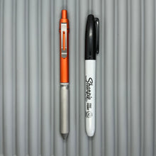 Load image into Gallery viewer, > Spoke Click Model CX: Lava Orange Aluminum / Matte Titanium Knurled Grip