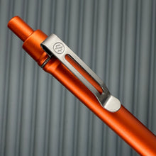 Load image into Gallery viewer, > Spoke Click Model CX: Lava Orange Aluminum / Matte Titanium Knurled Grip