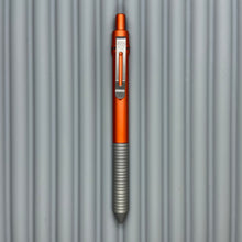 Load image into Gallery viewer, > Spoke Click Model C: Aluminum, Lava Orange / Matte Titanium Grooved Grip
