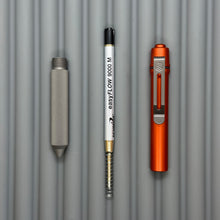 Load image into Gallery viewer, > Spoke Click Model C: Orange Lava Aluminum / Matte Titanium Peak Knurled Grip