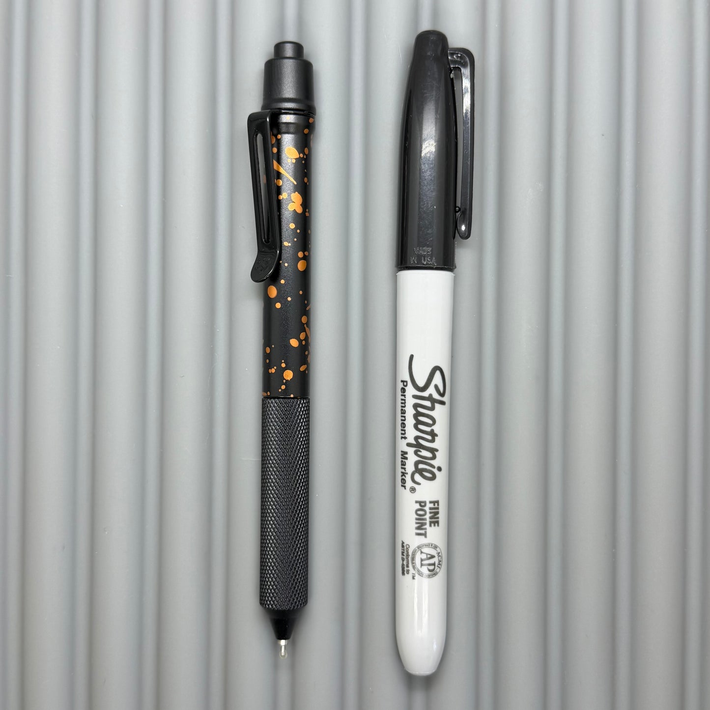 > Spoke Click Model C: Black with Orange Lava Splash, Aluminum / Black Aluminum Peak Knurled Grip