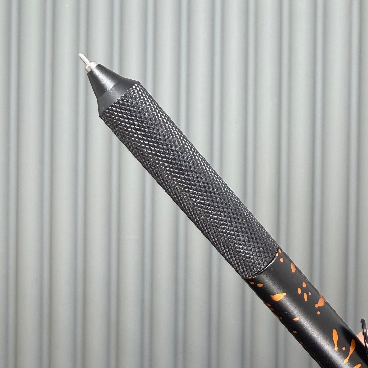 > Spoke Click Model C: Black with Orange Lava Splash, Aluminum / Black Aluminum Peak Knurled Grip