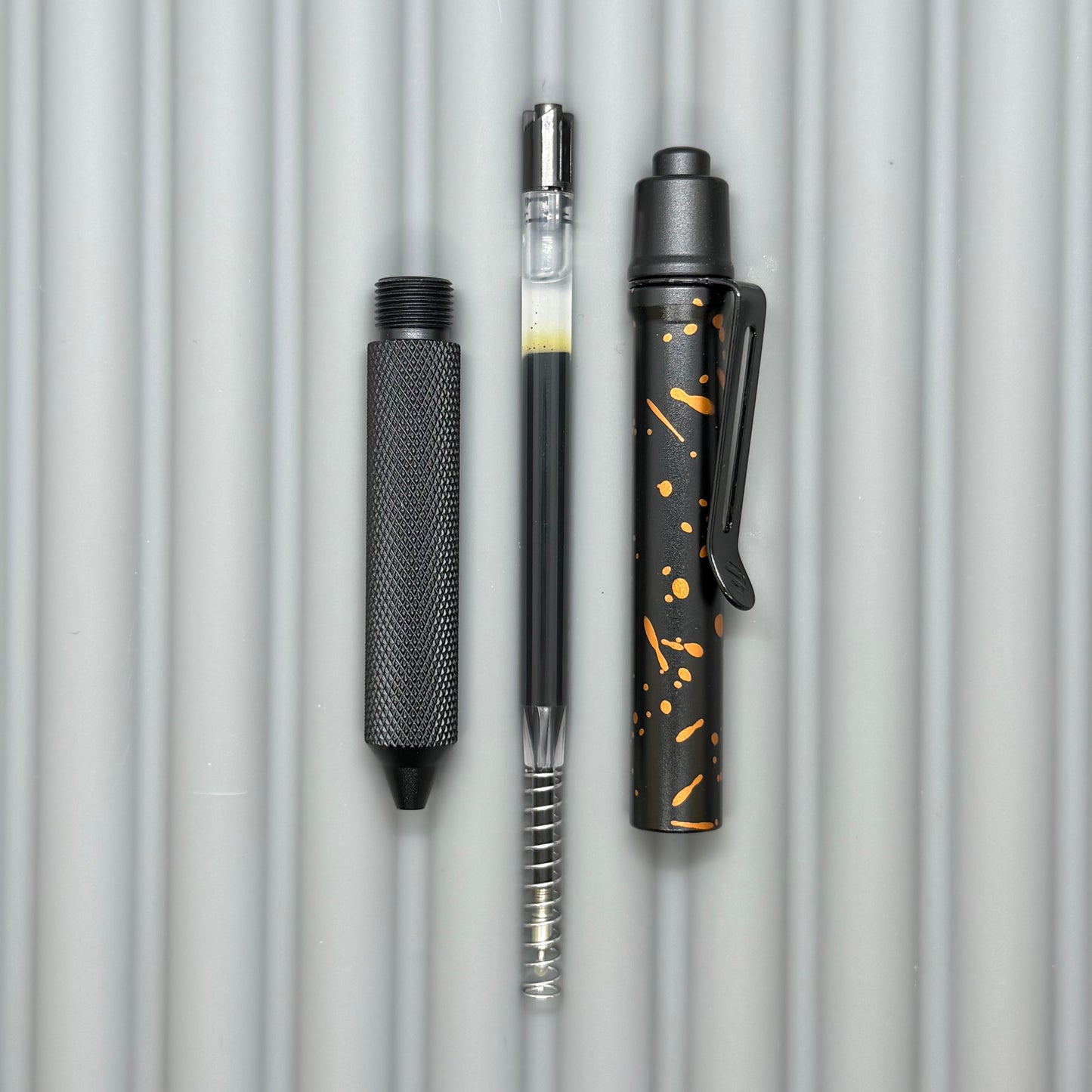 > Spoke Click Model C: Black with Orange Lava Splash, Aluminum / Black Aluminum Peak Knurled Grip