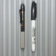 Load image into Gallery viewer, > Spoke Click Model C: Black with Orange Lava Splash, Aluminum / Matte Titanium Peak Knurled Grip