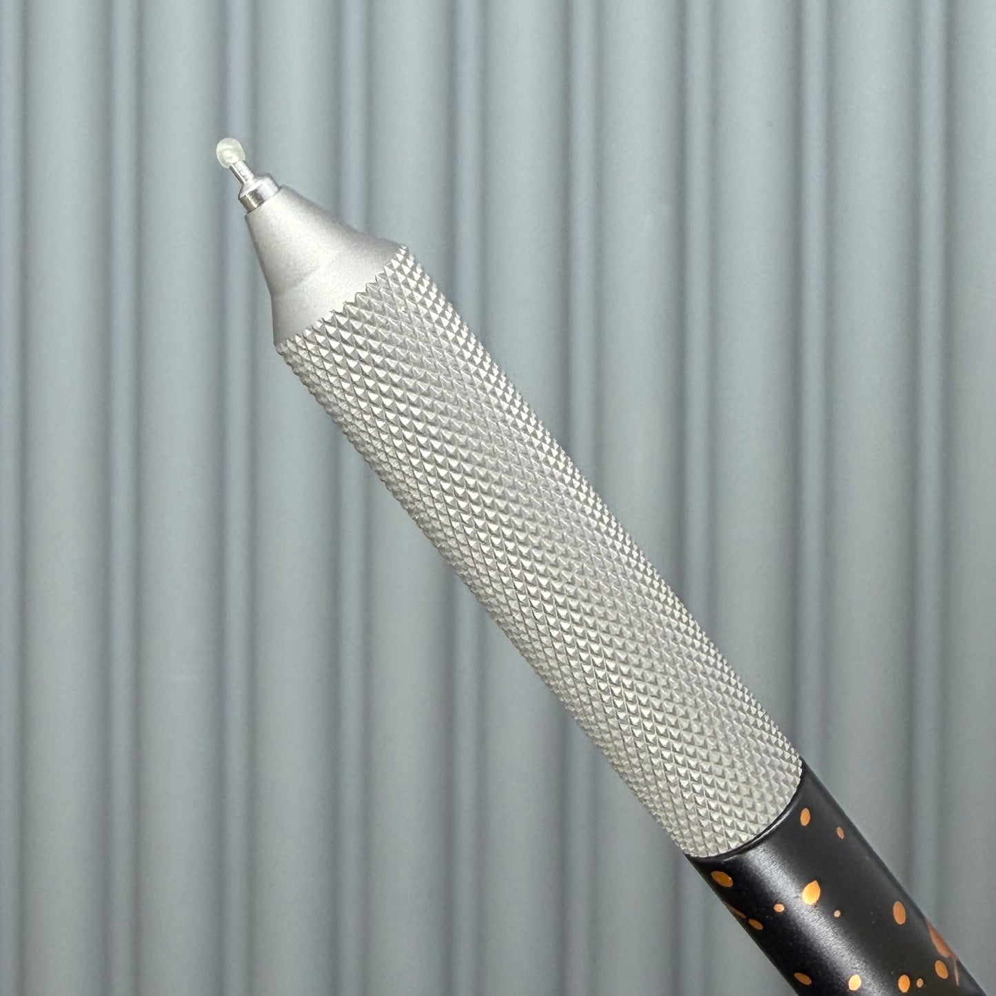 > Spoke Click Model C: Black with Orange Lava Splash, Aluminum / Matte Titanium Peak Knurled Grip