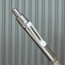 Load image into Gallery viewer, > Spoke Click Model CX: Gunmetal Ano Aluminum Barrel / Matte Titanium Grooved Grip