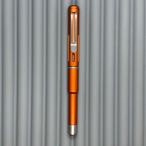 Roady XL / Slot Lava Orange - matte Titanium knurl grip