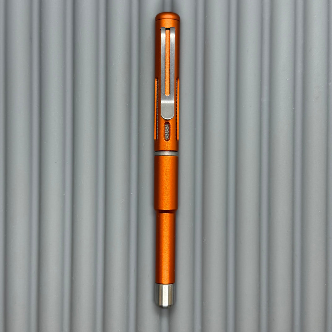 Roady XL / Slot Lava Orange - matte Titanium knurl grip